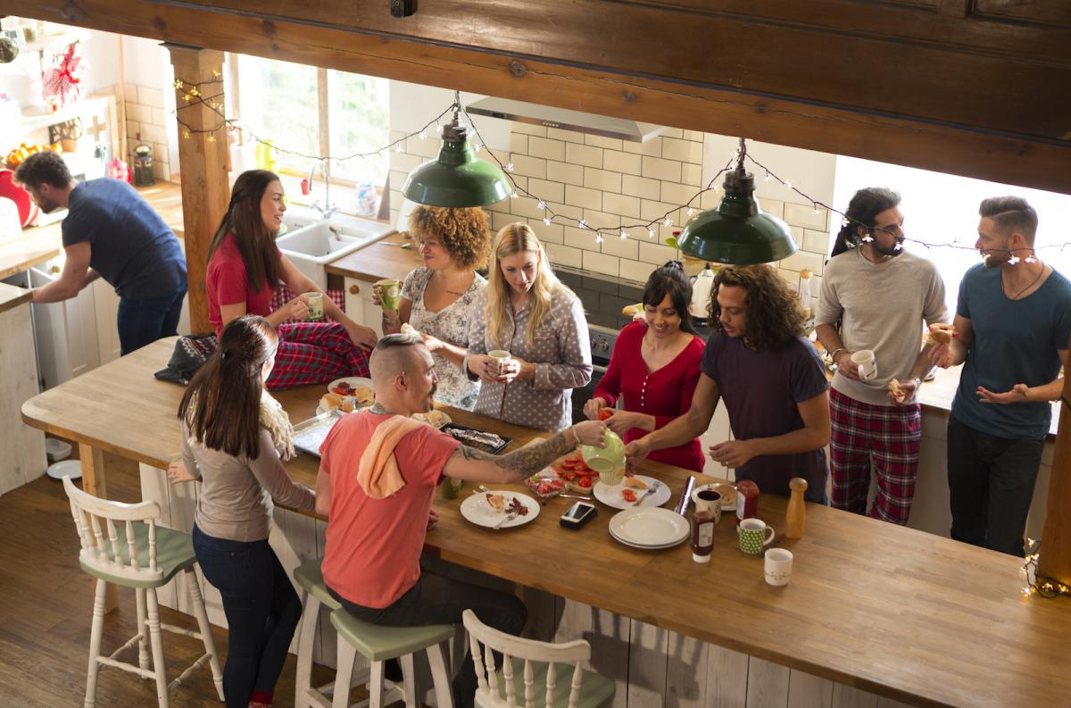 Family and friends gather for a holiday meal, respecting each other's boundaries.
