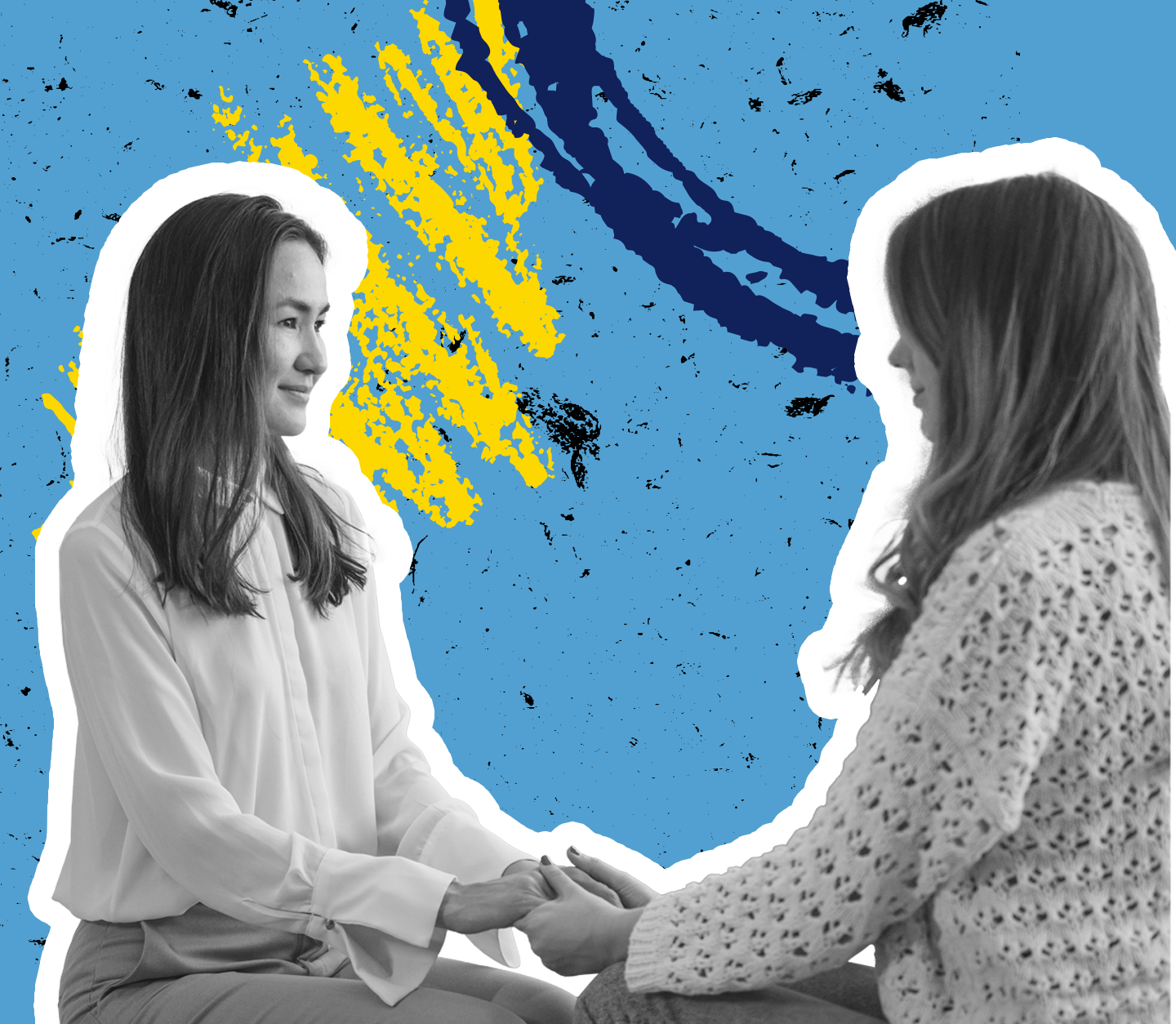 Two people hold hands, talking to one another, supporting each other