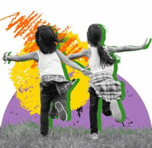 Two children running facing away from the camera.